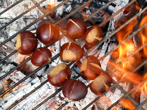 istock A group of chestnuts (Juglans regia) is roasting on the grill 2181369336
