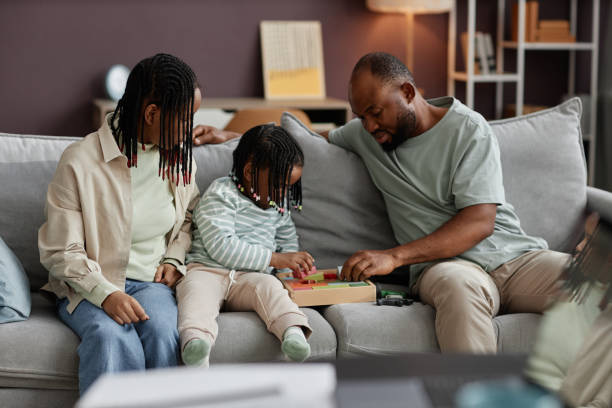 istock Family Engaging in Educational Board Game Activity at Home 2181377831