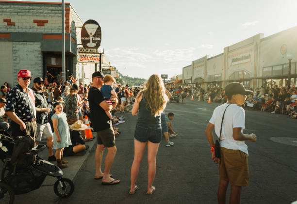 Williams, Arizona, USA,  July 4, 2024: Parade on the streets for the 4th of July Independence Day on the Route 66 in Williams, Arizona. People waiting for the parade. Man with MAGA hat, Trump supporter