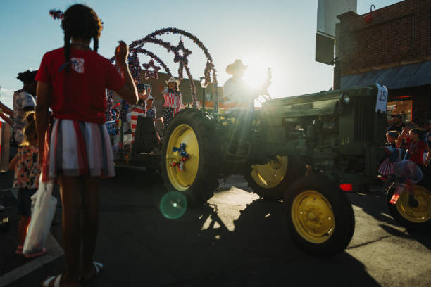 Williams, Arizona, USA,  July 4, 2024: Parade on the streets for the 4th of July Independence Day on the Route 66 in Williams, Arizona. People enjoy the parade with characters marching on the town main road