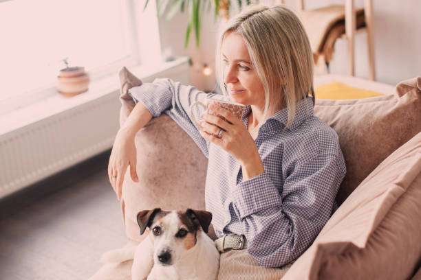 istock Calm peaceful Woman drinking tea or coffee at home 2181380517