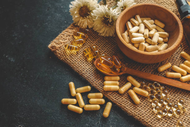 istock Natural vitamins organic on dark background 2181380825