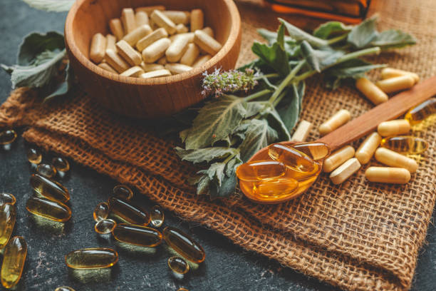 istock Natural vitamins organic on dark background 2181380826