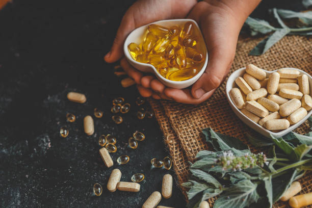 istock Natural organic vitamins in hands close-up 2181380840
