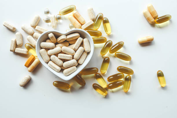istock Tablets and vitamins on white background, banner advertising, pharmaceuticals 2181380843