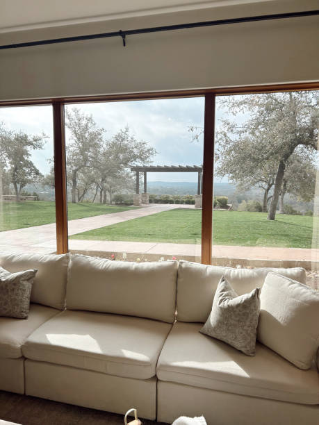 Charming elegance: a cozy white couch with countryside wedding views