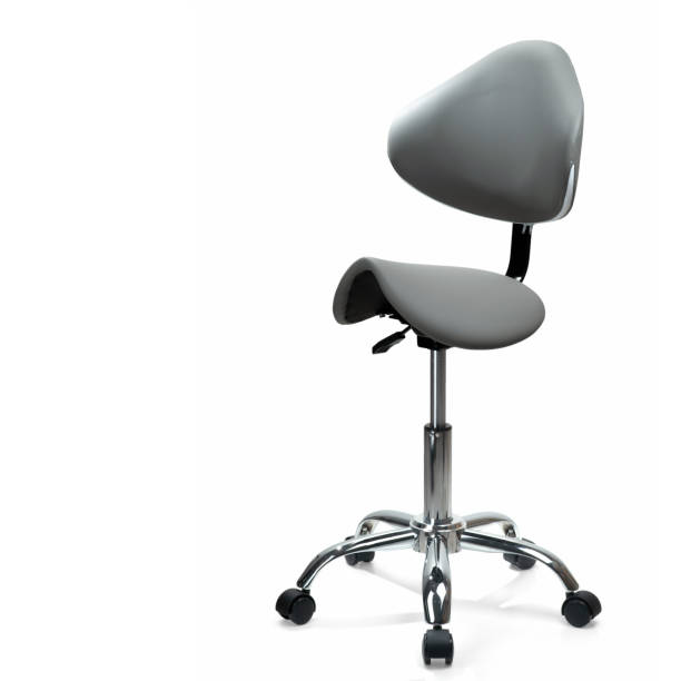 Grey saddle chair with backrest on casters. Isolated on white background. Ergonomic lab chair.