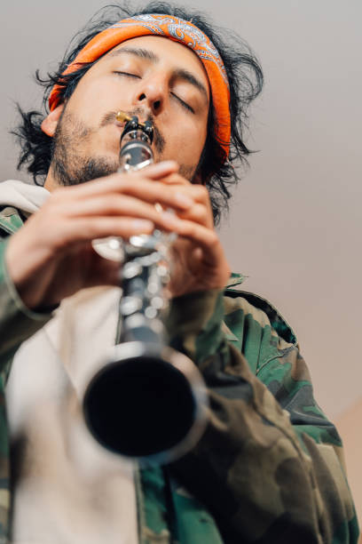 Clarinet player classical musician. Man playing orchestra music woodwind instrument