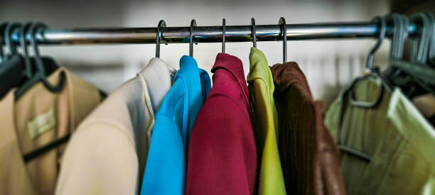 istock Autumn wardrobe. Warm autumn clothes. Wardrobe analysis. Sorting things 2181385140