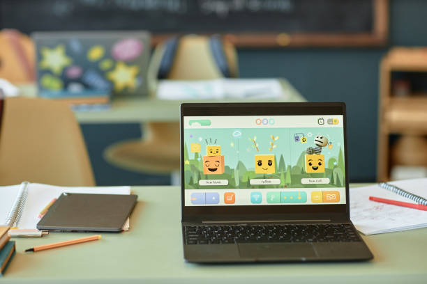 Open Laptop in Kids Classroom with Characters on Screen