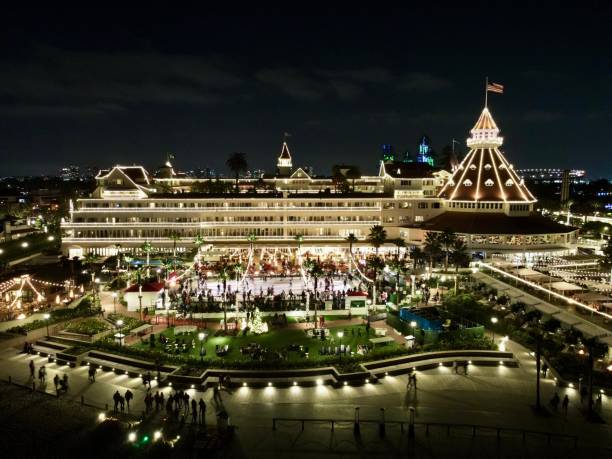 The legendary Hotel del Coronado was built in 1888 and designated a National Historic Landmark by the U.S. Secretary. This espectacular aerial photo displays its decorative Christmas Lights during its season.