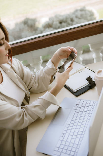 istock Young woman with laptop 2181393779