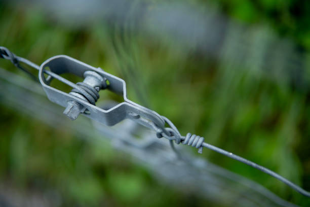 metallic guaya tensioning device installed outdoors