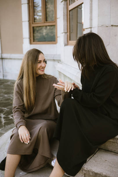 istock Two cheerful women hanging out 2181394118