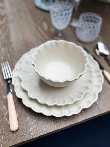 istock Image of dinner party table set / white plates and dishes / elegant cutlery / knife, fork, spoon / refined dining experience 2181396245