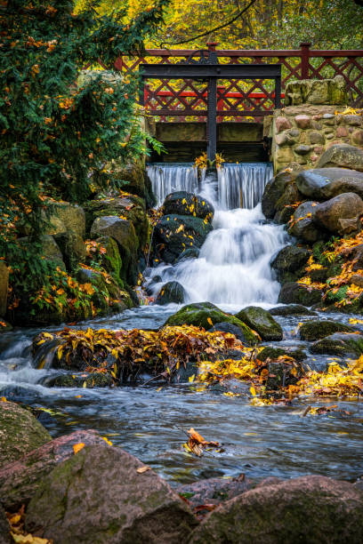 istock Waterfall in the beautiful autumn garden 2181396783