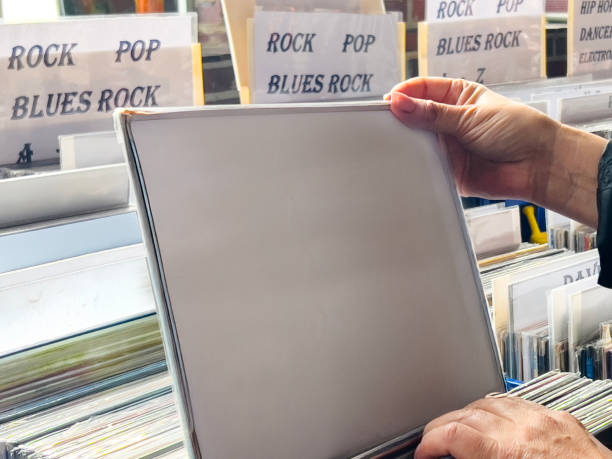 istock Female hand picking vinyl records. 2181399113