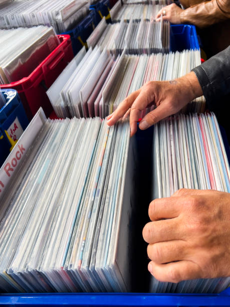 istock Male hand picking vinyl records. 2181399135