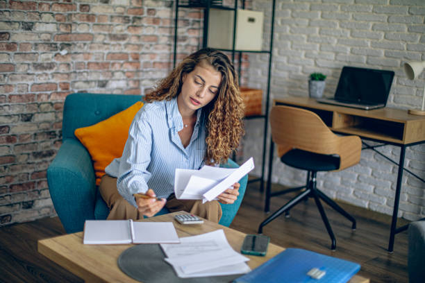 istock Woman doing financial planning at her home 2181400533