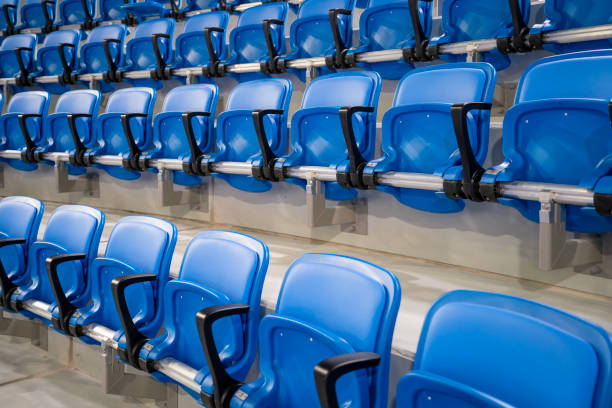 istock A long row of modern blue chairs with folding seats in a hall 2181401989