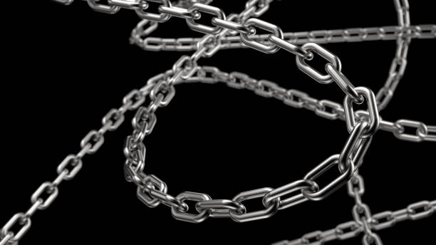 A close-up studio shot of weathered steel chain links on a black background