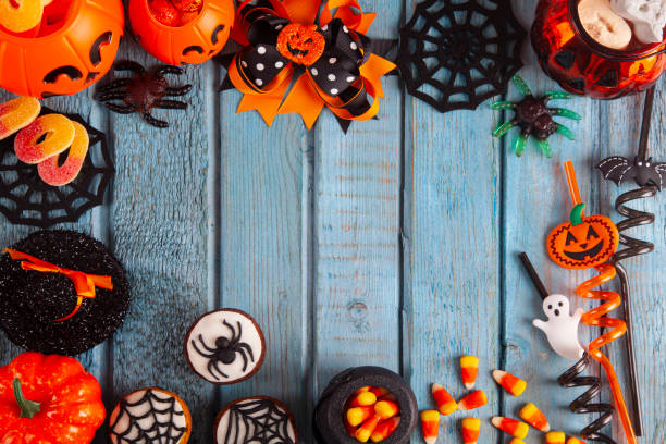istock Halloween party decorations frame on blue wooden rustic table 2181409979