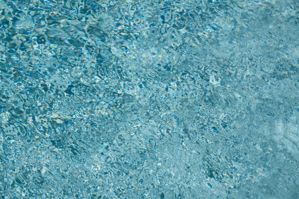 istock Blue pool water background. Blurred transparent clear calm water surface texture. Water waves in sunlight with copy space. 2181416423