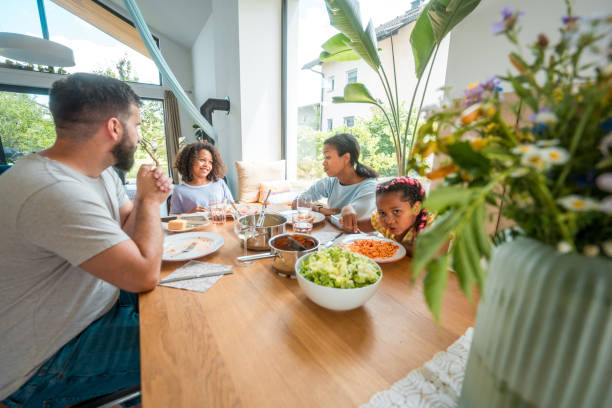 istock Cheerful Family Enjoying a Home-cooked Lunch 2181416756