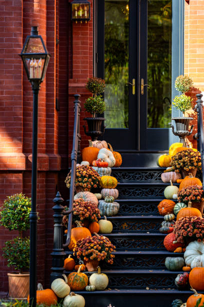 istock Halloween pumpkin decorations. Pumpkin for decorated house. Halloween Decorated at front yard of a American home. Halloween decorated front door with pumpkins. Autumn holiday of Halloween. 2181417253