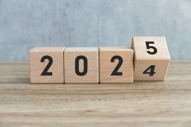 istock Transition from 2024 to 2025 Represented by Wooden Blocks with Numbers 2181417430