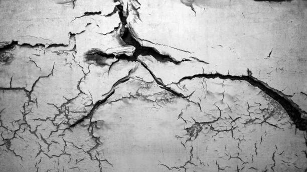 istock Surface of white concrete wall with cracks and holes. Abstract pattern of concrete wall 2181427986