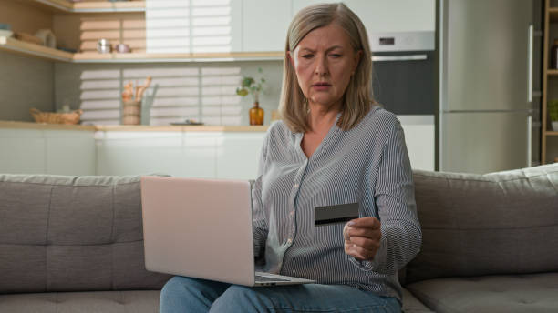 istock Mature caucasian woman retired senior lady dissatisfied client experiencing problem on laptop with online payment failure bank credit card error mistake unsuccessful transaction trouble wrong password 2181437537