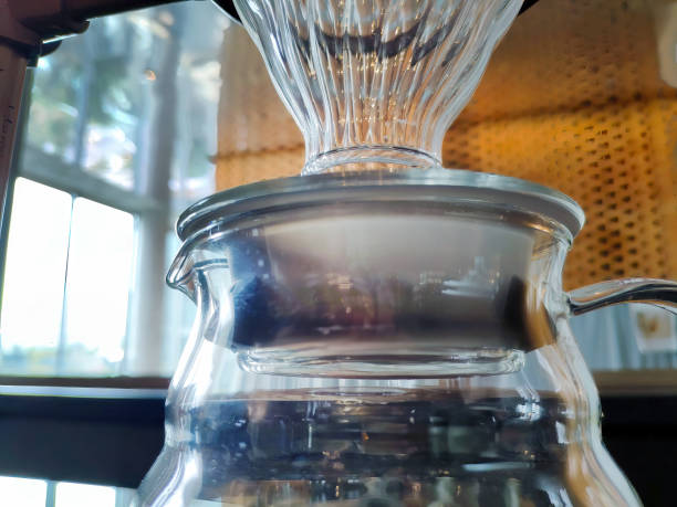 Set of pourover coffee server including heat resistant glass dripper mug, reusable filters or clever dripper, and wooden stand bracket holder, hand drip machine
