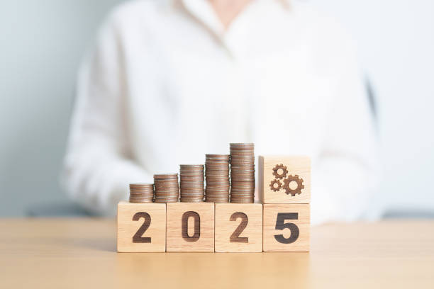 istock Happy New Year 2025 with Coins stack and gear icon. business Process, Team, teamwork, Strategy, goal, Money, Budget, investment, financial and New Year Resolution concept 2181439655