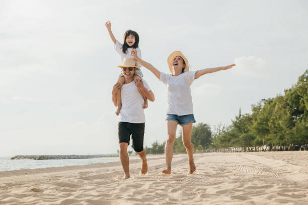 istock Happy people having fun in summer vacation on beach 2181442027