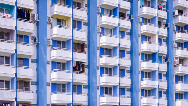 istock Condominium building background, rows of white and blue apartment balconies backdrop 2181444945