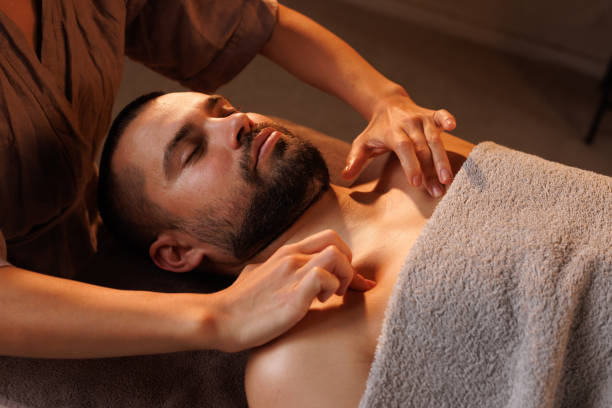 istock Man gets chest massage in spa, enjoying relaxing atmosphere, recovering from work 2181448053