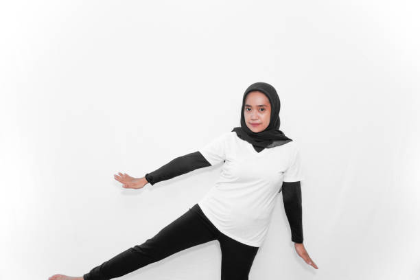istock Basic gymnastics movements demonstrated by women wearing hijabs and white clothes 2181448793