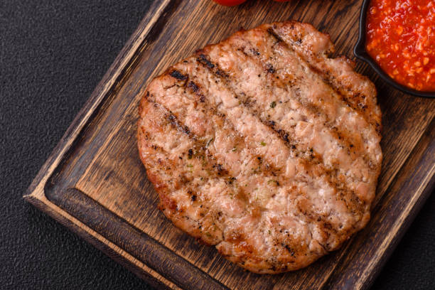 istock Juicy grilled beef or pork steak with salt, spices and herbs 2181450523