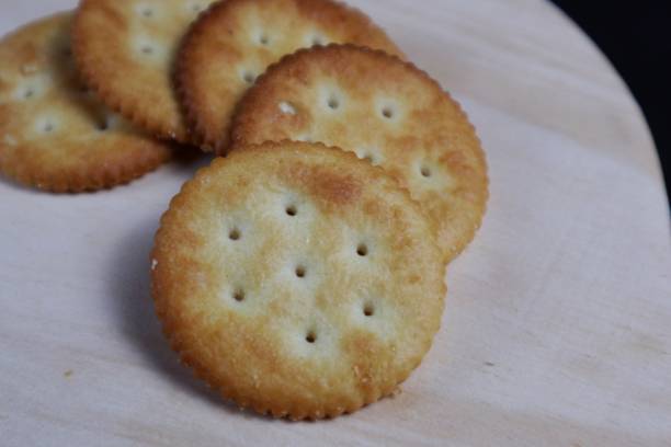 istock Close up of stack of round saltine crackers 2181452343