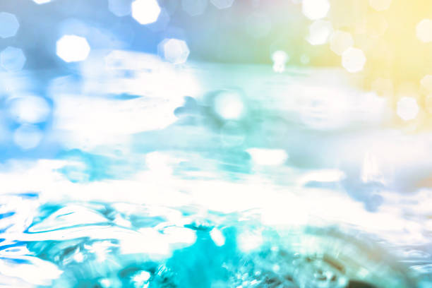 Empty background with bubbles in slight blur at high magnification. Background with close-up of drinking water in soft focus.