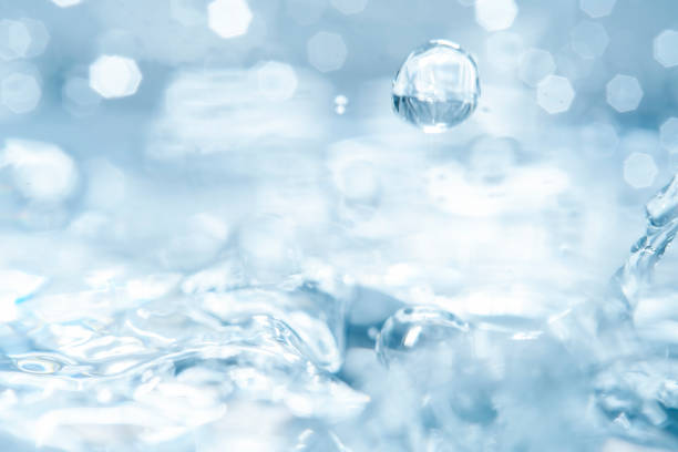 istock Empty background with bubbles in slight blur at high magnification. Background with close-up of drinking water in soft focus. 2181453070