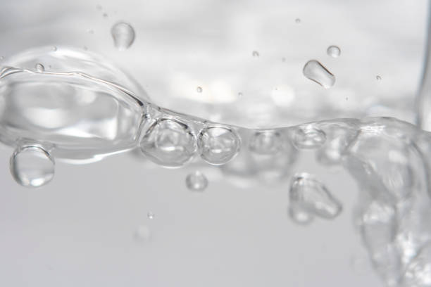 istock Empty background with bubbles in slight blur at high magnification. Background with close-up of drinking water in soft focus. 2181453076