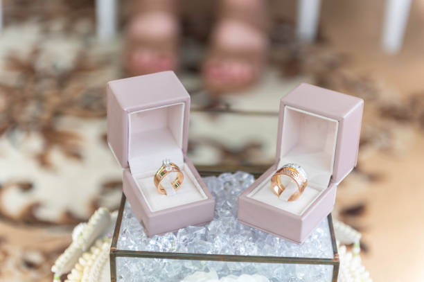 istock Wedding ring set in a pink ring box on a white background. 2181455483