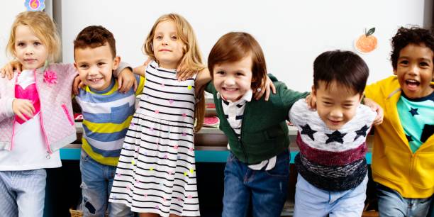 istock Group of diverse children smiling in classroom. 2181455721