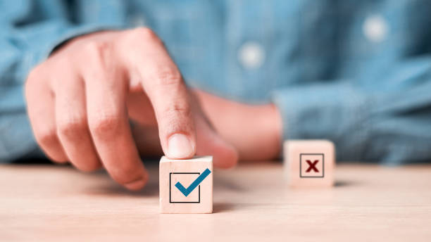 istock Businessman select blue correct sign mark between Red Cross mark which print screen on wooden for approve and reject business project proposal concept. 2181456228
