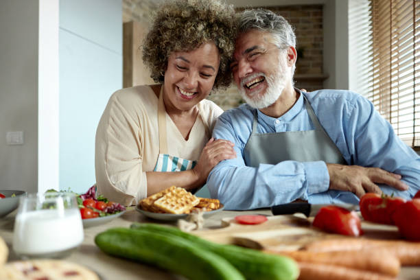 istock Cheerful senior couple having fun in the kitchen. 2181456470
