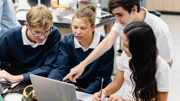 istock Diverse group of students collaborate in science lab. 2181456508