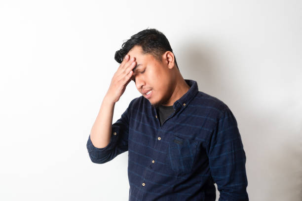 istock Adult Asian man with head down showing stress expression 2181458199