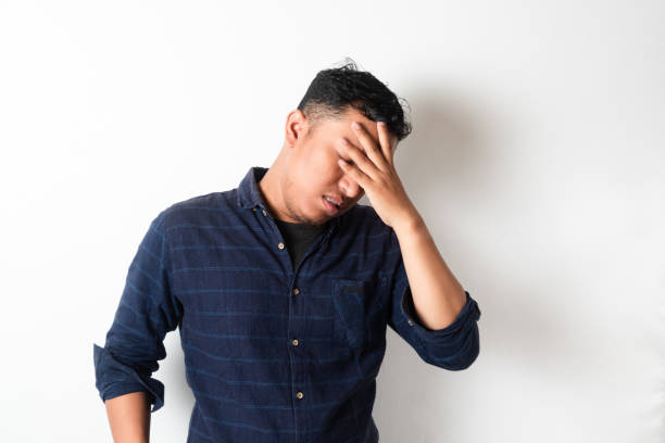 istock Adult Asian man with head down showing stress expression 2181458200